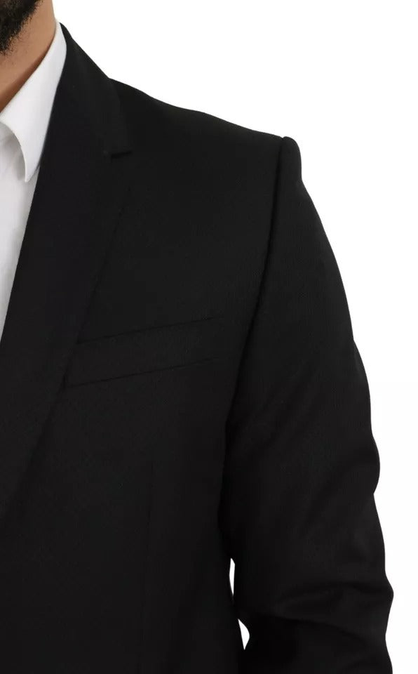Experience the allure of the Dolce & Gabbana Black Wool Slim Fit Notch Jacket Blazer, a masterpiece of Italian craftsmanship that embodies timeless elegance and sophistication.