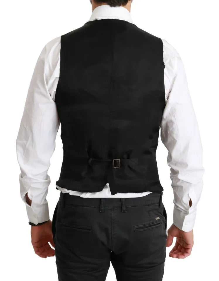 Experience the exquisite craftsmanship of the Dolce & Gabbana Black Solid STAFF Slim Fit Waistcoat Vest, a timeless piece that embodies luxury and sophistication for the discerning individual.