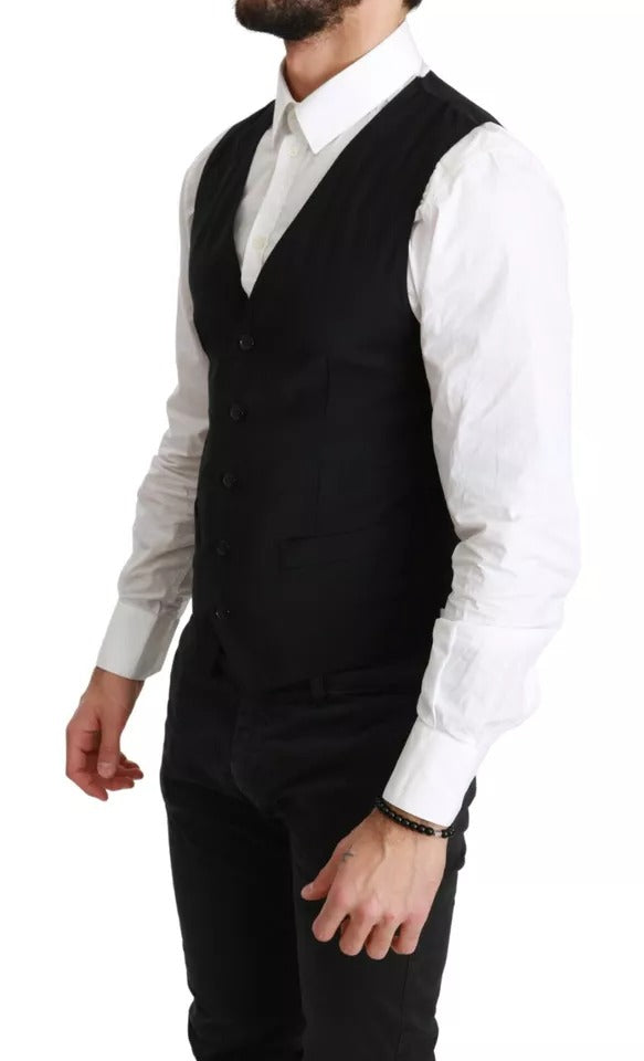 Elevate your style with the Dolce & Gabbana Black Solid STAFF Slim Fit Waistcoat Vest, a masterpiece of Italian craftsmanship that embodies timeless luxury and sophistication.