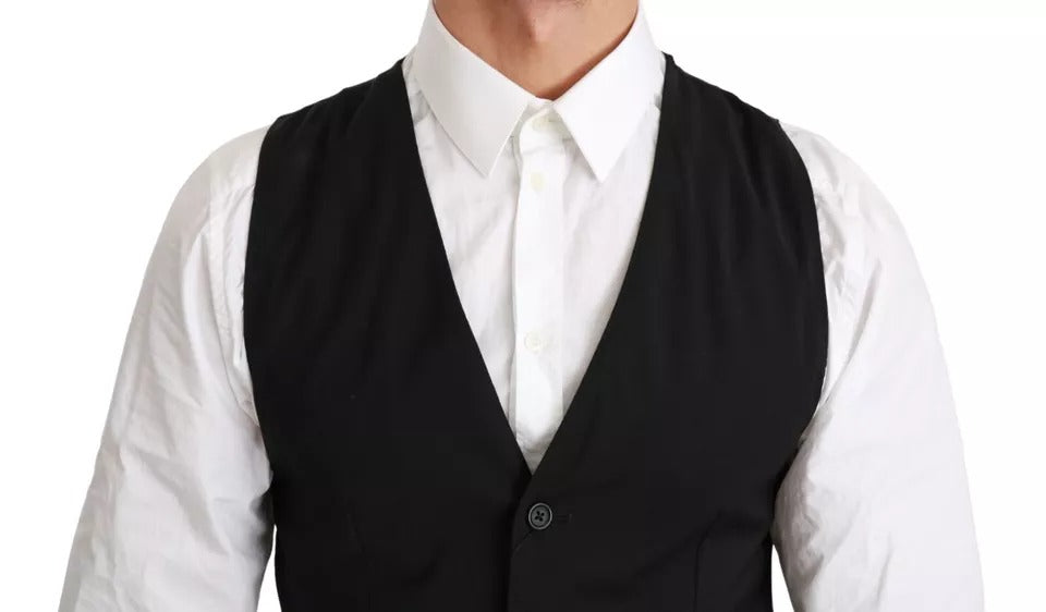 Discover the exquisite Dolce & Gabbana Black Solid STAFF Slim Fit Waistcoat Vest, a timeless blend of luxurious materials and artisanal craftsmanship, perfect for the discerning individual.