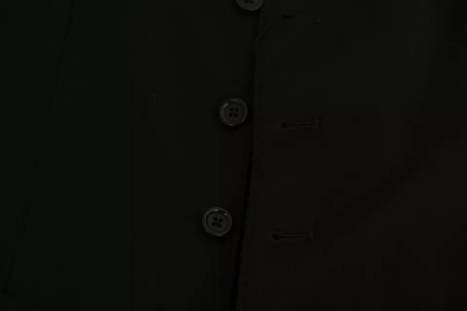 Experience the timeless elegance of Dolce & Gabbana's Black Solid STAFF Slim Fit Waistcoat Vest, a luxurious blend of craftsmanship and sophistication for discerning tastes.