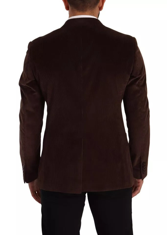 Discover the Dolce & Gabbana Brown Corduroy Slim Fit Coat, a masterpiece of Italian craftsmanship, blending luxurious cotton and silk for an elegant silhouette.