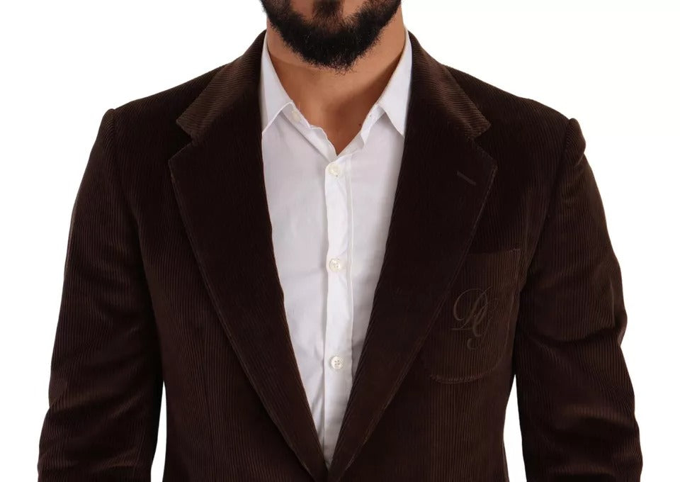 Discover the exquisite Dolce & Gabbana Brown Corduroy Slim Fit Coat, a luxurious blend of 100% cotton and silk, embodying timeless elegance and sophisticated allure.