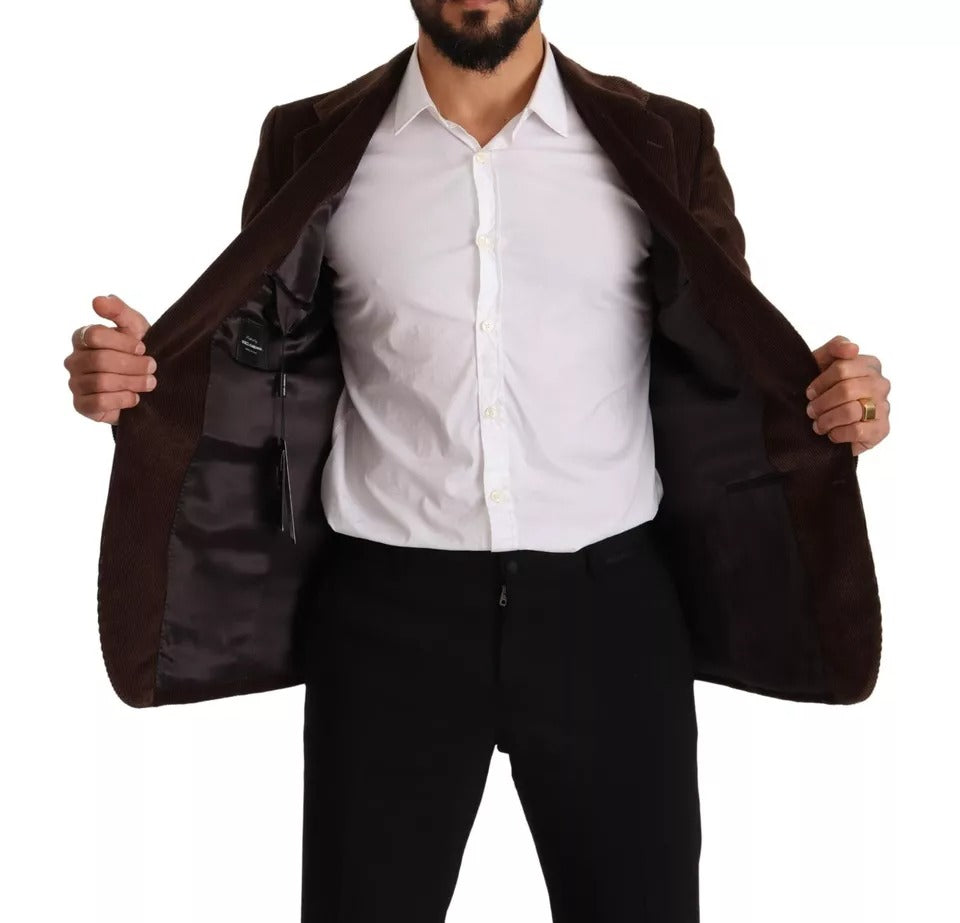 Elevate your wardrobe with the Dolce & Gabbana Brown Corduroy Slim Fit Coat, a masterpiece of Italian craftsmanship that exudes timeless elegance and sophistication.
