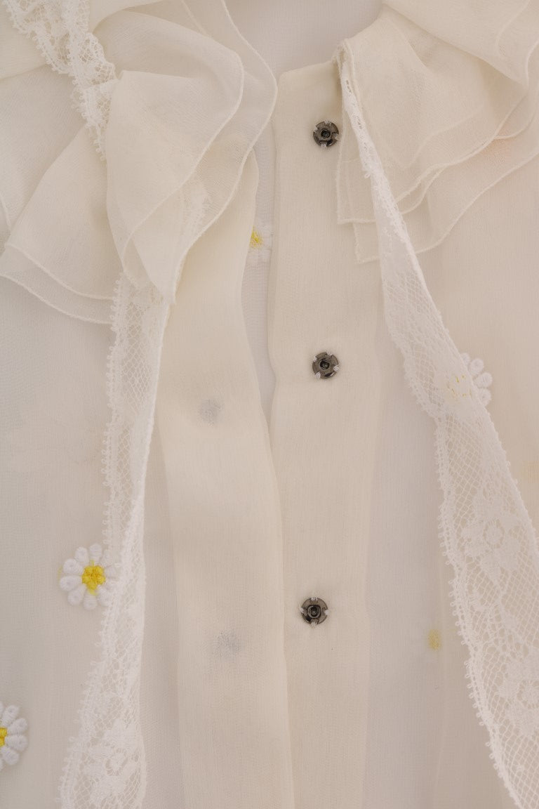Indulge in the exquisite Dolce & Gabbana White Daisy Applique Silk Shirt, a masterpiece of Italian craftsmanship that embodies timeless elegance and sophisticated allure.
