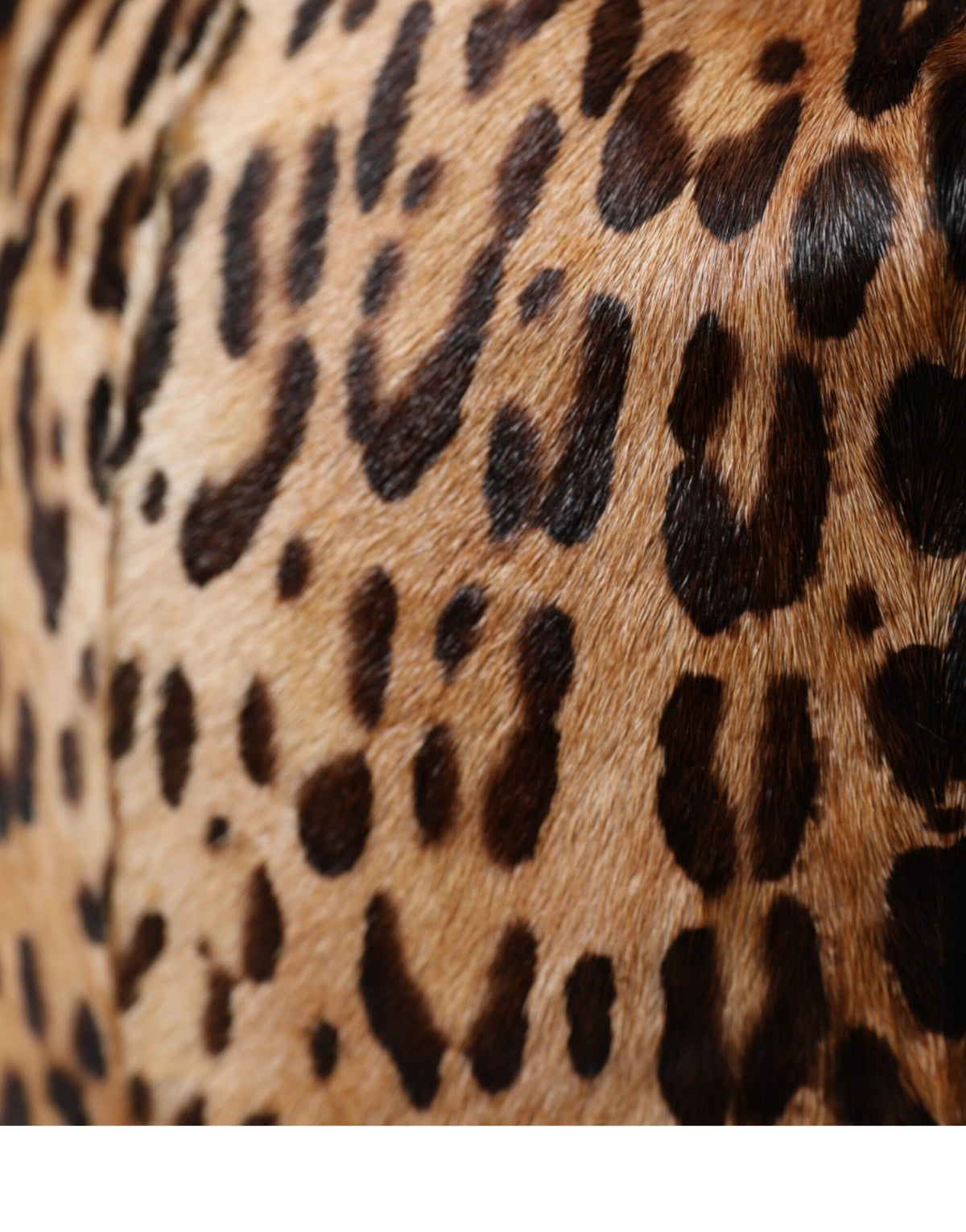 Elevate your style with the Dolce & Gabbana Brown Leopard Fur Bucket Hat, a masterpiece of artisan luxury crafted from premium goat leather, perfect for the discerning individual.