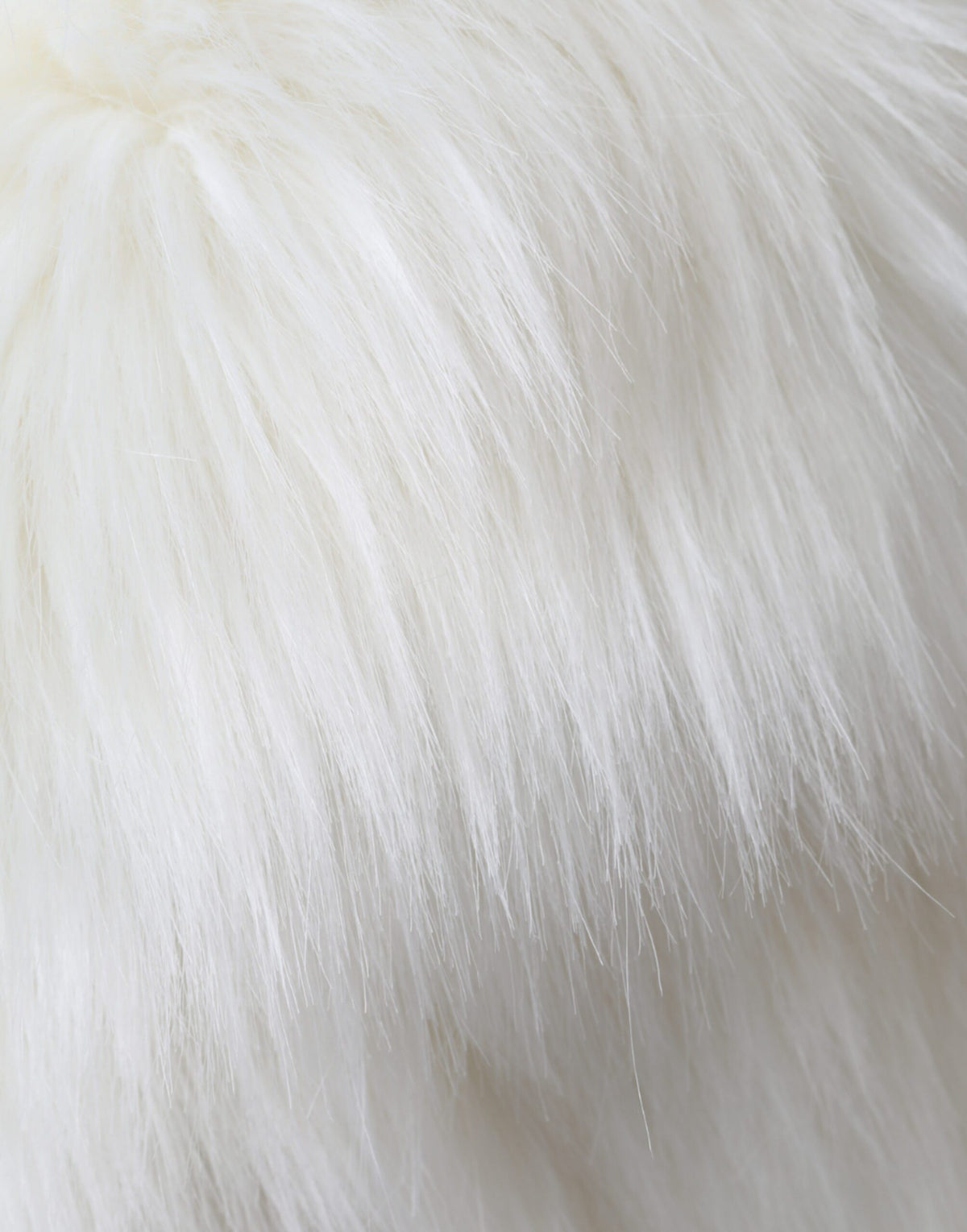 Indulge in the exquisite allure of the Dolce & Gabbana White Acrylic Fur Women's Bucket Hat, a masterpiece of luxurious craftsmanship that elevates your style for any occasion.