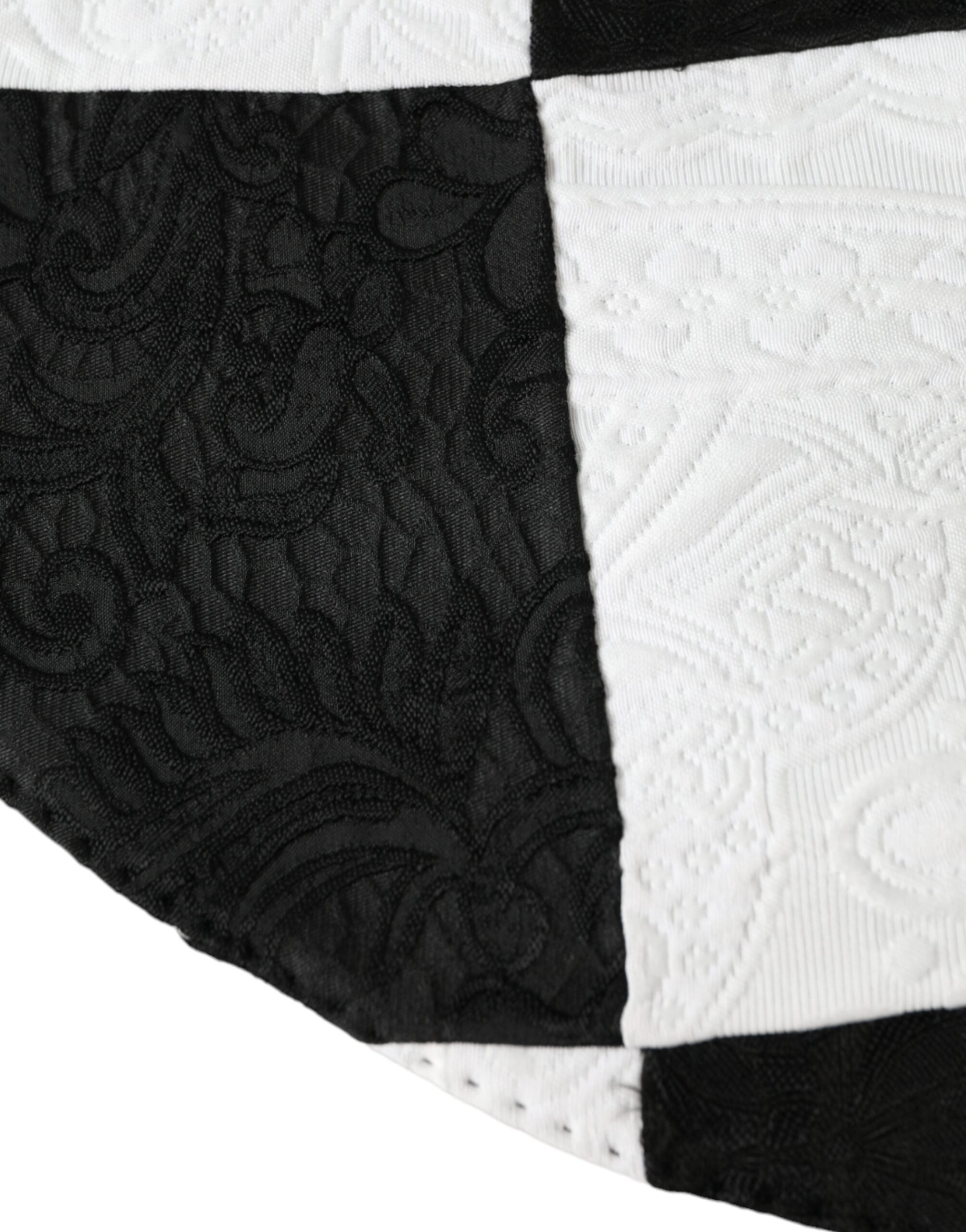 Elevate your style with the Dolce & Gabbana Black White Checkered Wide Brim Floppy Hat, a luxurious accessory crafted in Italy, perfect for sun-soaked elegance.
