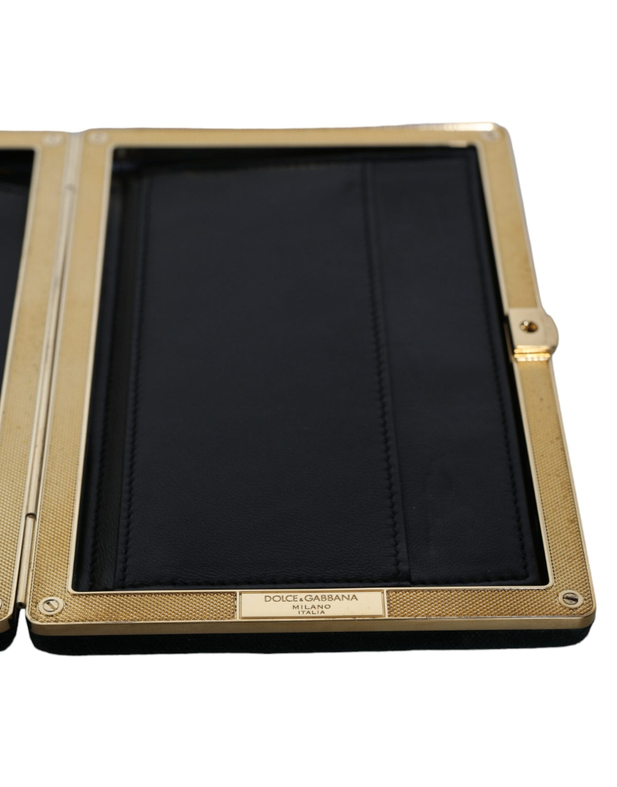 Indulge in the exquisite Dolce & Gabbana Black Velvet Gold Frame Clutch, a masterpiece of Italian craftsmanship that elevates your evening elegance with opulent sophistication.