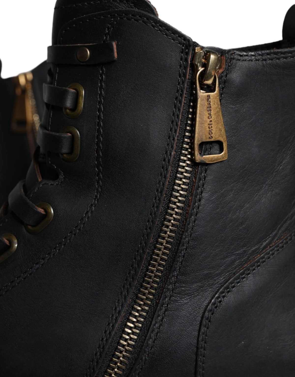 Indulge in the exquisite Dolce & Gabbana Black Lace Up Mid Calf Boots, crafted from luxurious calf leather, embodying timeless elegance and sophisticated allure for the discerning individual.