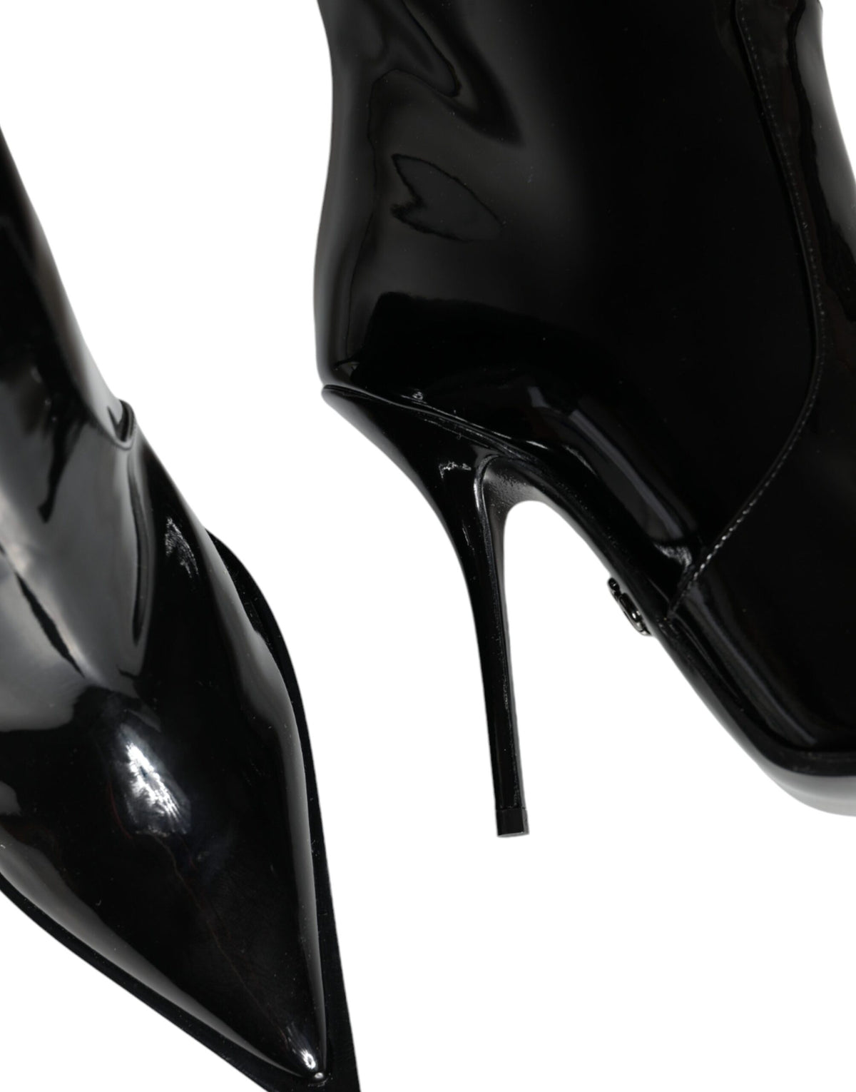 Step into timeless elegance with Dolce & Gabbana's Black Patent Leather Knee High Boots, a luxurious blend of exquisite craftsmanship and sophisticated allure, perfect for any occasion.
