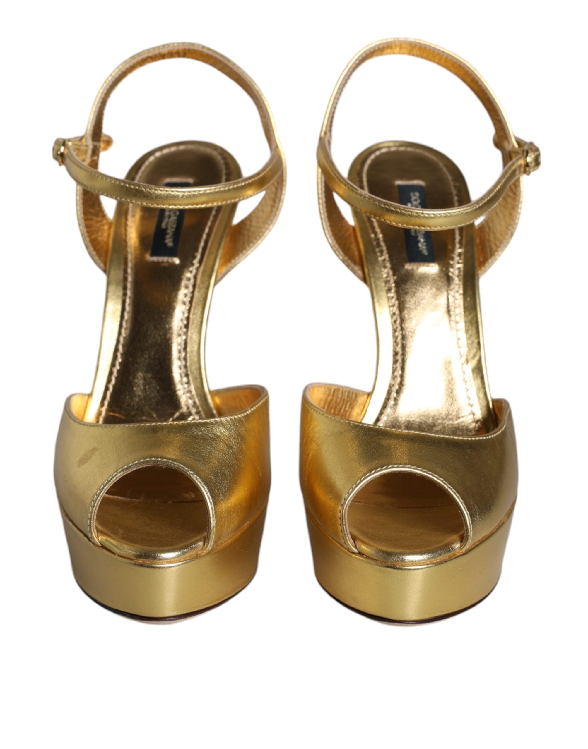 Experience the exquisite allure of Dolce & Gabbana Gold Bette Leather Heels, crafted from sumptuous lamb leather, embodying elegance and sophistication for the discerning fashion aficionado.