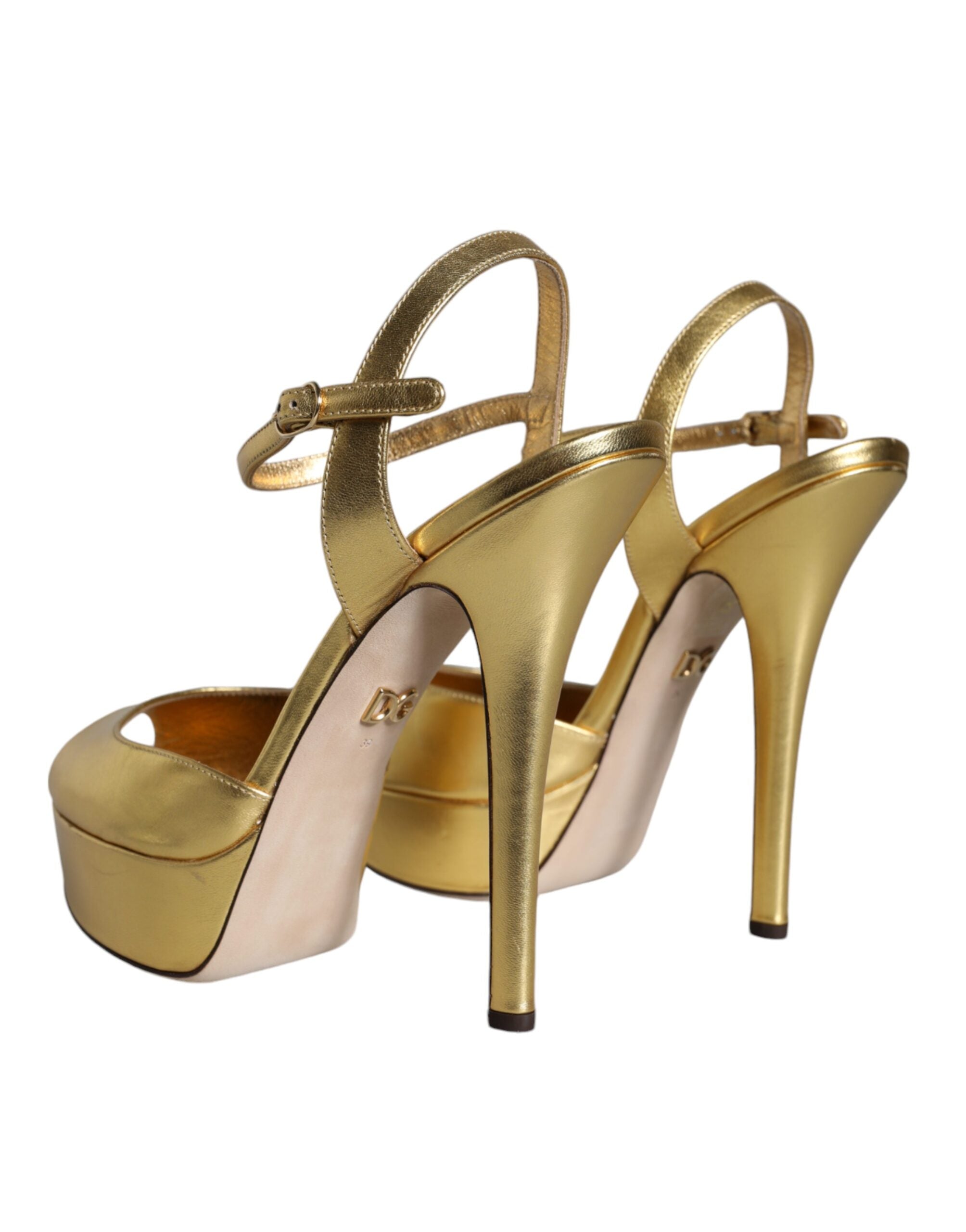 Indulge in the exquisite allure of Dolce & Gabbana Gold Bette Leather Heels, crafted from sumptuous lamb leather, embodying elegance and sophistication for the discerning fashion aficionado.