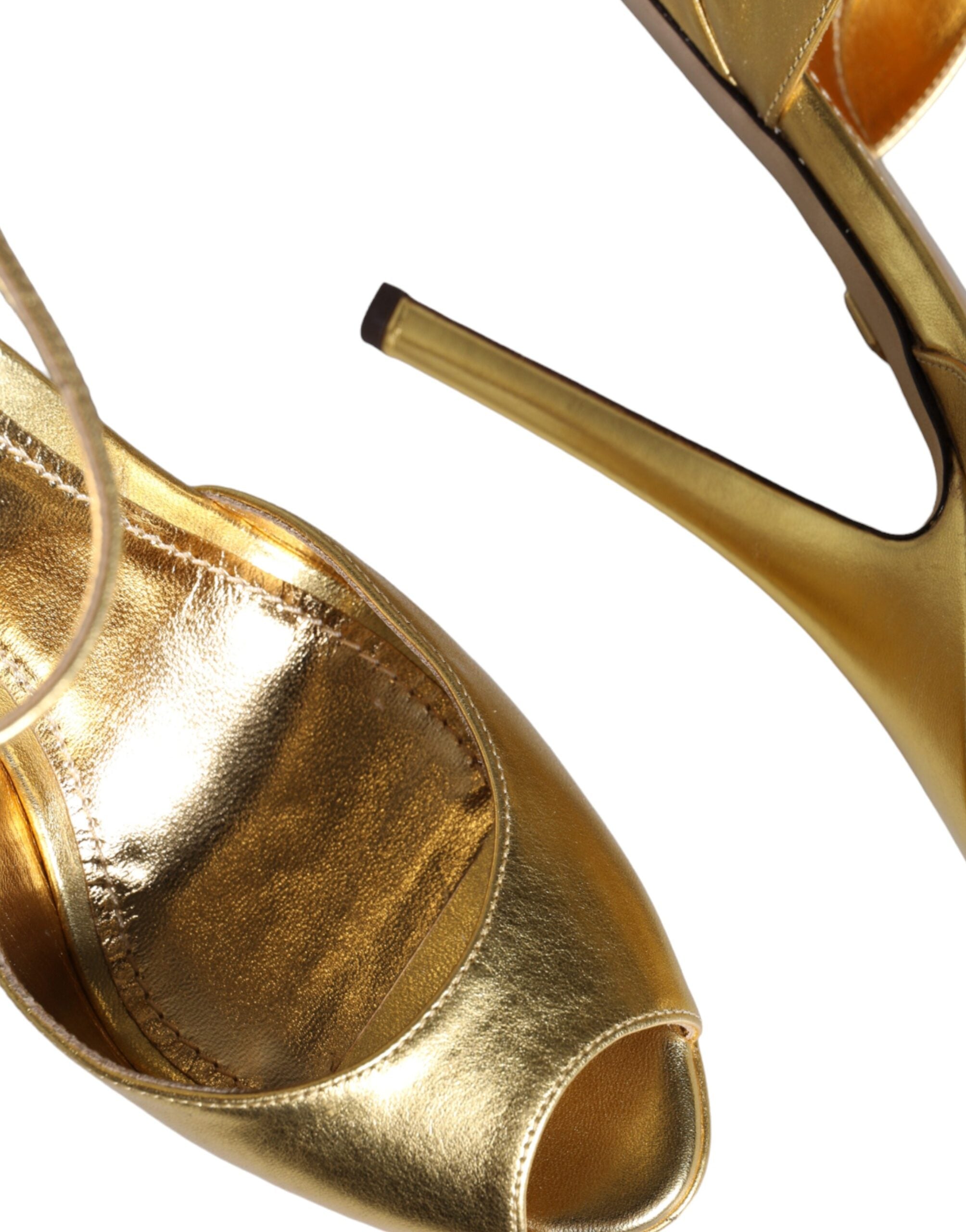 Indulge in the exquisite allure of Dolce & Gabbana Gold Bette Leather Heels, crafted from luxurious lamb leather, embodying elegance and sophistication for the discerning fashion aficionado.