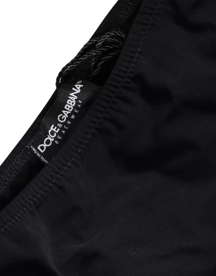 Indulge in the exquisite allure of Dolce & Gabbana's Black Nylon Swimwear Bikini Bottom, crafted for those who embody elegance and confidence in every sun-kissed moment.
