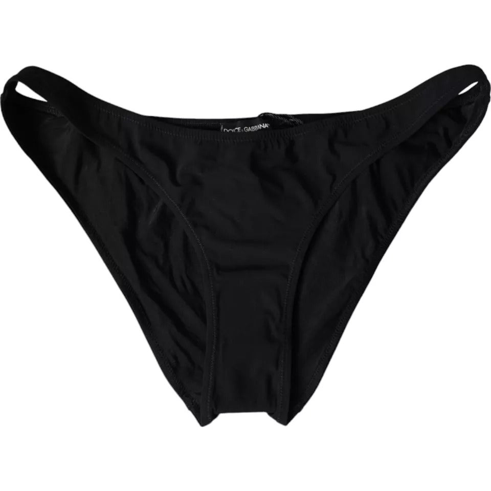 Elevate your beachside allure with Dolce & Gabbana's Black Nylon Swimwear Bikini Bottom, crafted in Italy for the discerning individual who embodies luxury and sophistication.