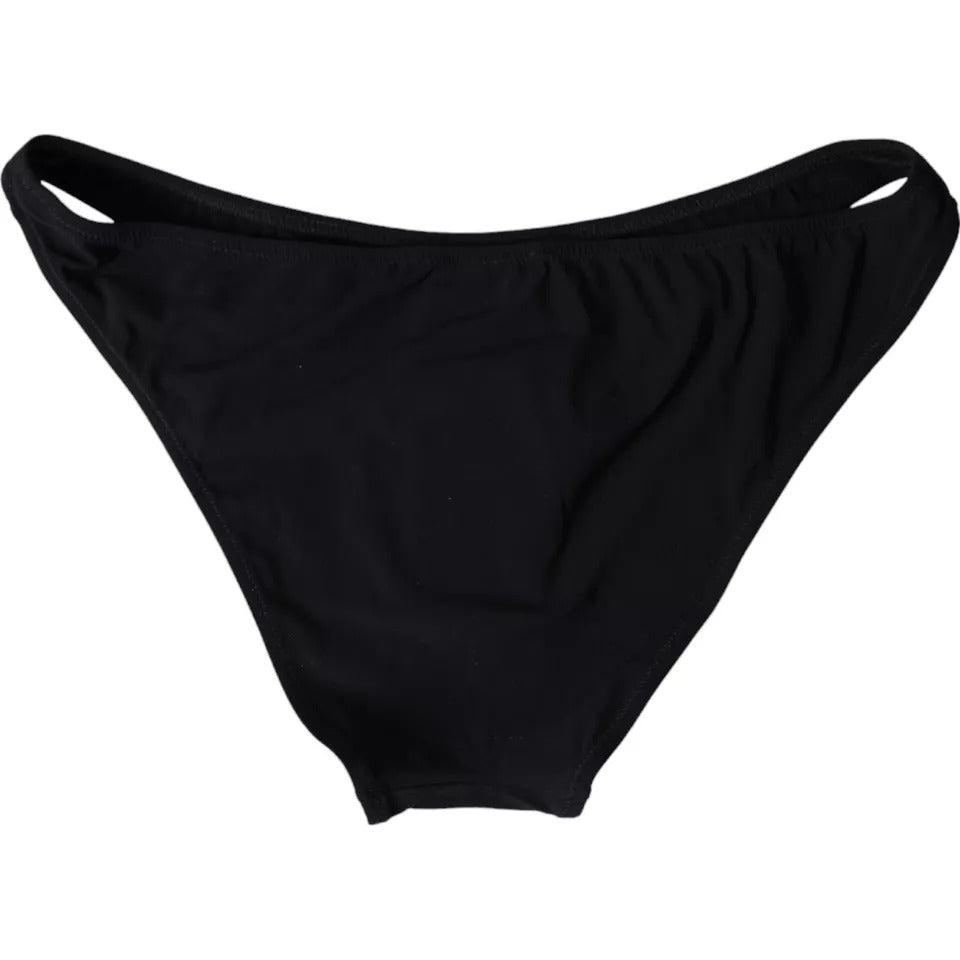 Elevate your beachside elegance with the Dolce & Gabbana Black Nylon Swimwear Bikini Bottom, a luxurious blend of comfort and sophistication crafted for the discerning individual.