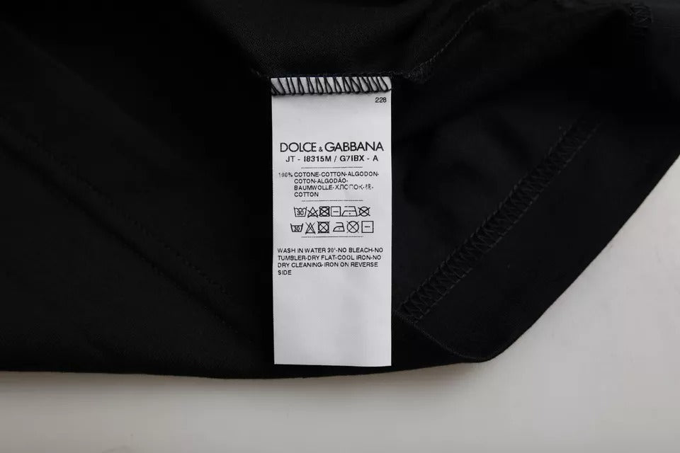 Elevate your wardrobe with the Dolce & Gabbana Black Cotton Round Neck T-shirt, a luxurious blend of Italian craftsmanship and timeless sophistication.