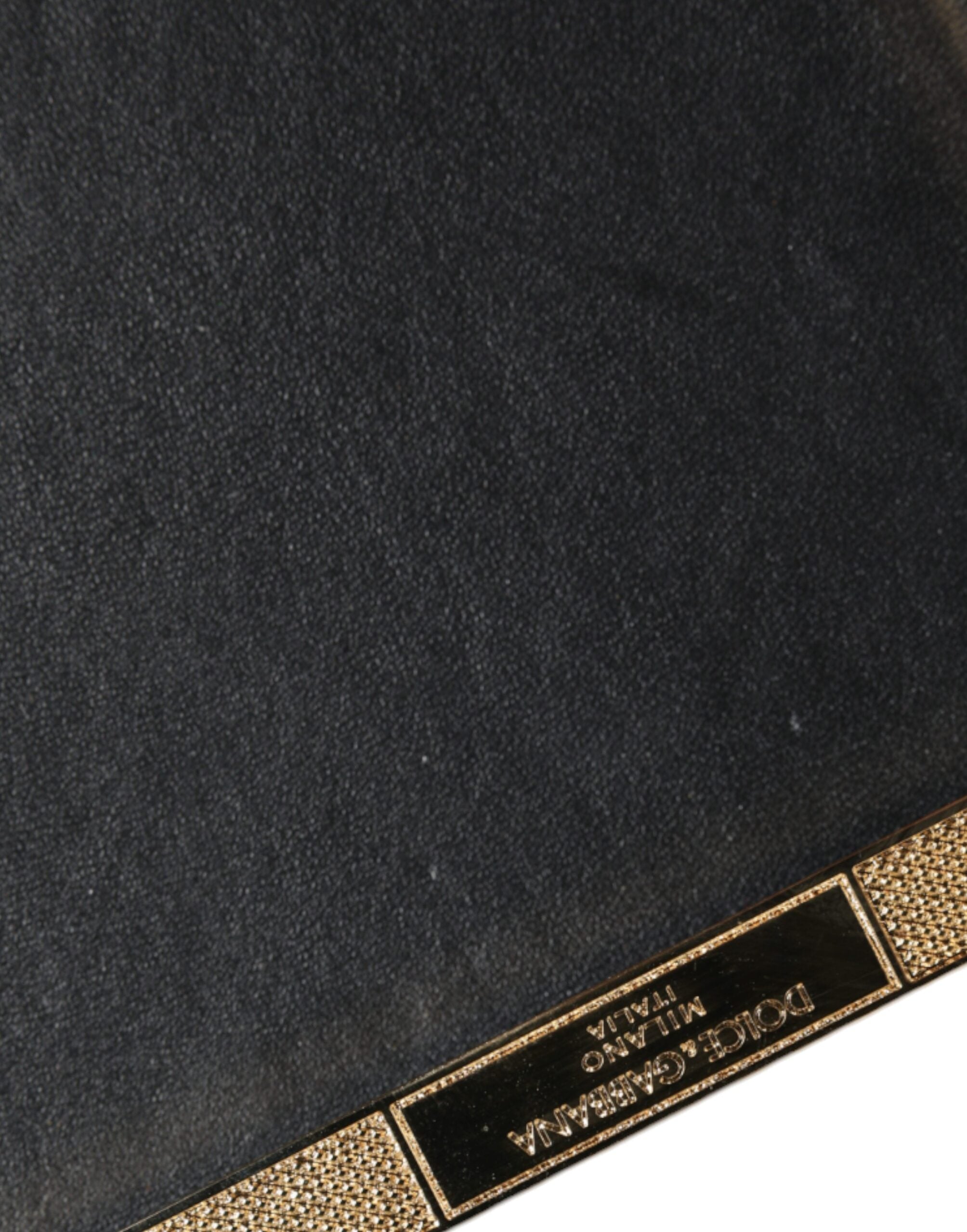 Discover the Dolce & Gabbana Gold Crystal Bifold Clutch, a masterpiece of Italian craftsmanship in luxurious leather, perfect for elevating your evening elegance.