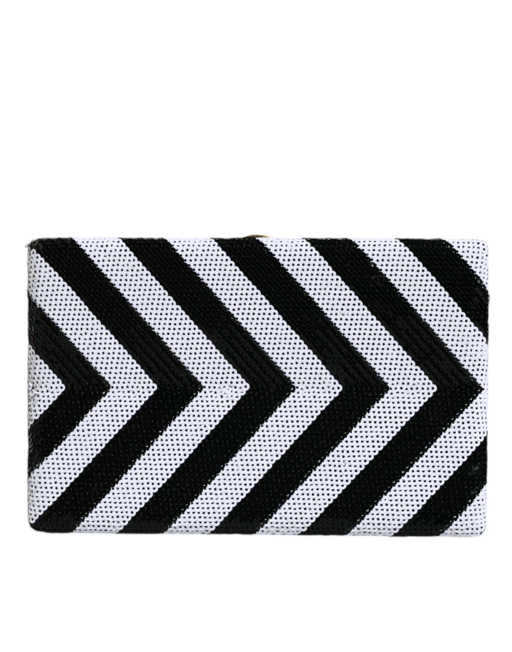 Elevate your evening allure with the Dolce & Gabbana Black White Gold Frame Clutch, a masterpiece of Italian craftsmanship, blending luxurious materials for timeless sophistication.