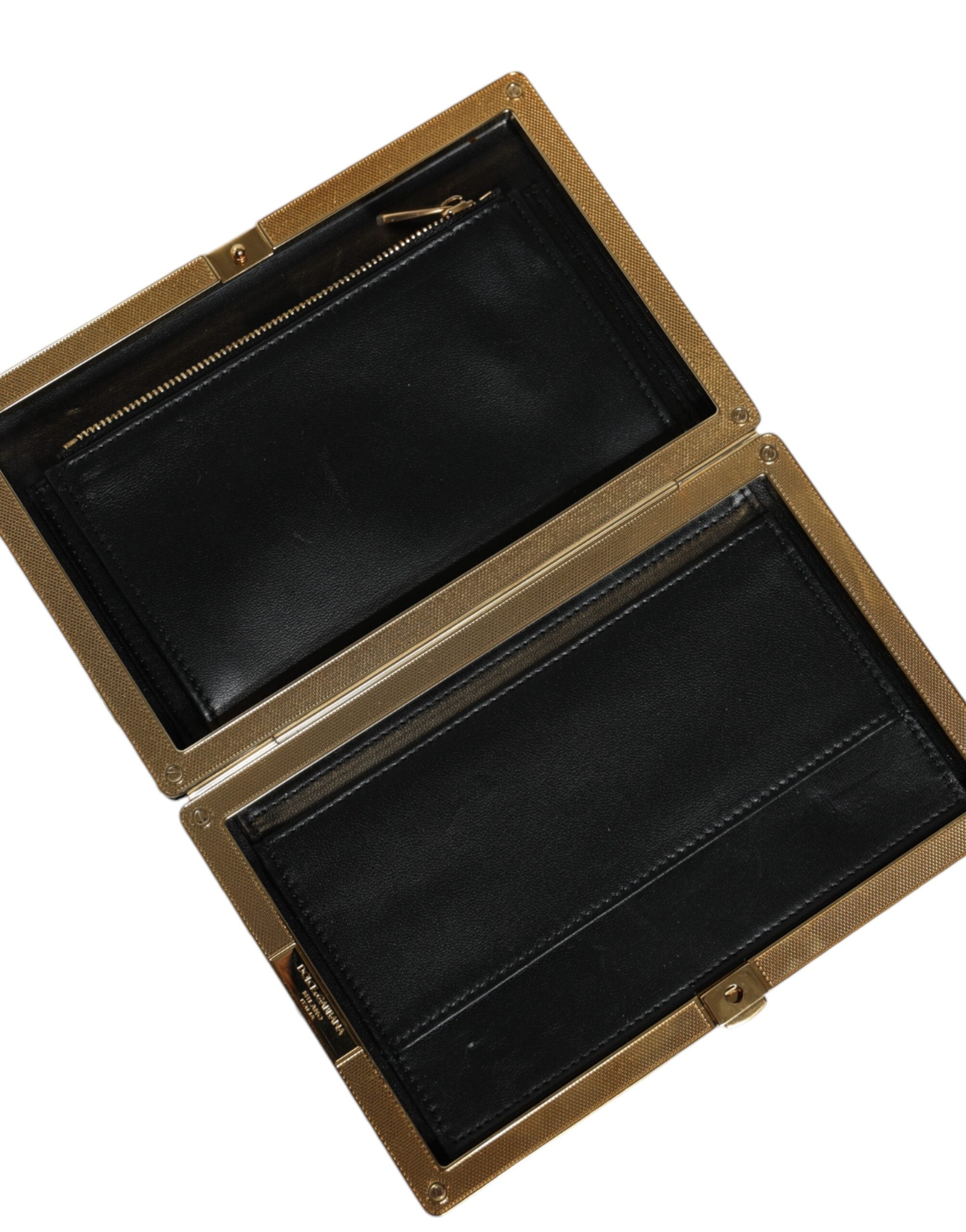 Elevate your evening with the Dolce & Gabbana Black White Gold Frame Clutch, a masterpiece of Italian craftsmanship, blending luxurious materials for timeless sophistication.