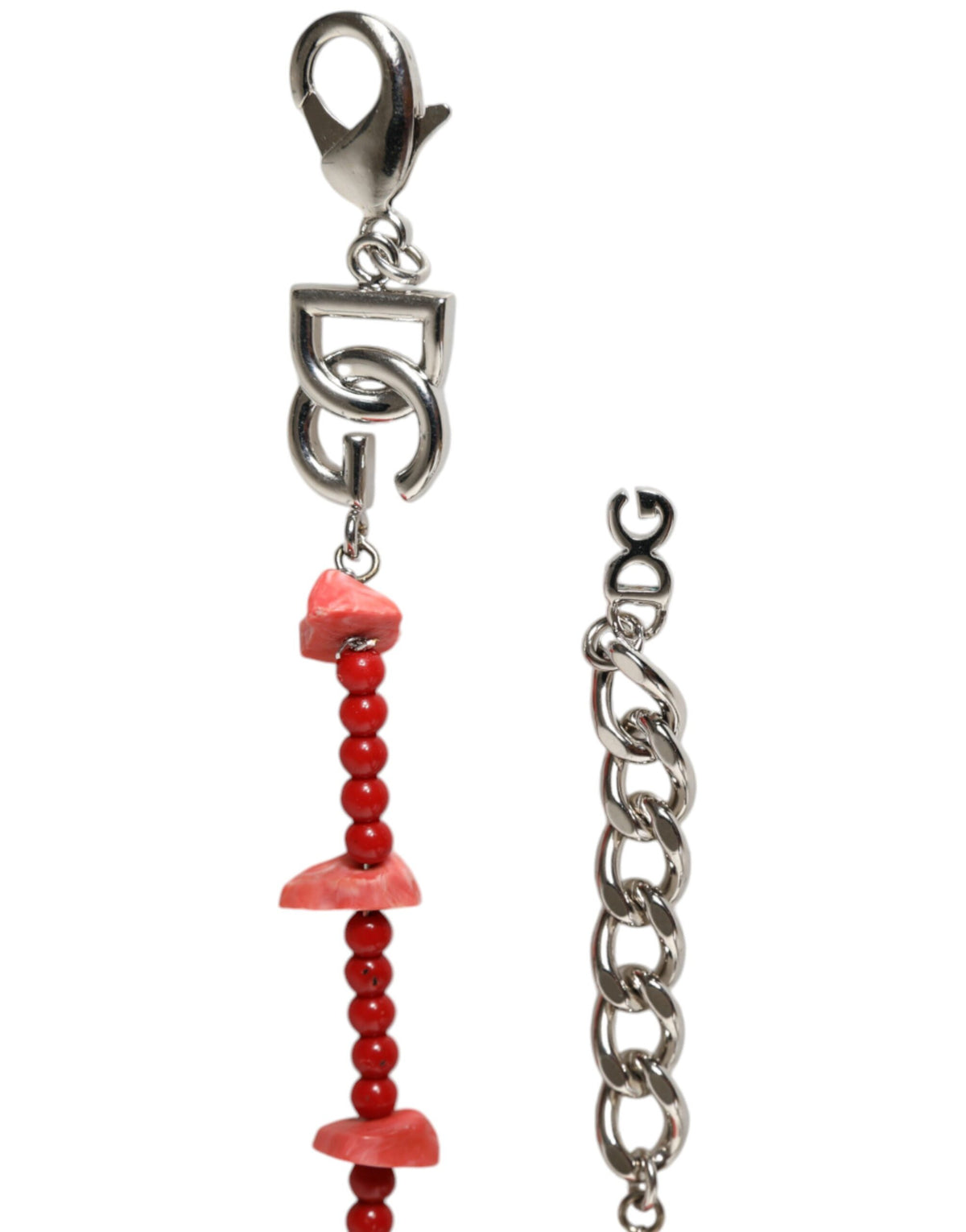 Experience the allure of the Dolce & Gabbana Silver Tone Brass Beaded Resin DG Logo Chain Bracelet, a masterpiece of Italian craftsmanship that embodies timeless elegance and sophisticated style.