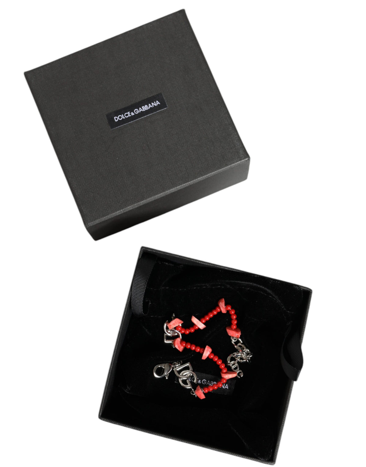 Discover the Dolce & Gabbana Silver Tone Brass Beaded Resin DG Logo Chain Bracelet, a masterpiece of Italian craftsmanship that exudes timeless elegance and allure.