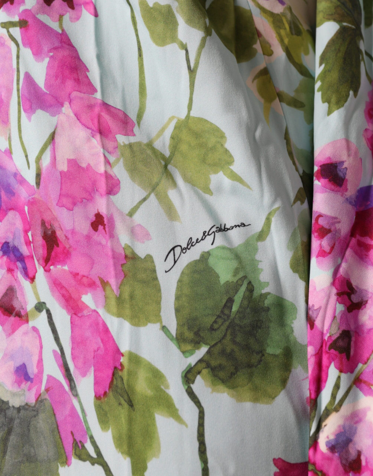 Experience the allure of the Dolce & Gabbana Multicolor Floral Silk Stretch Wrap Dress, a testament to Italian craftsmanship that embodies elegance and sophistication for any occasion.