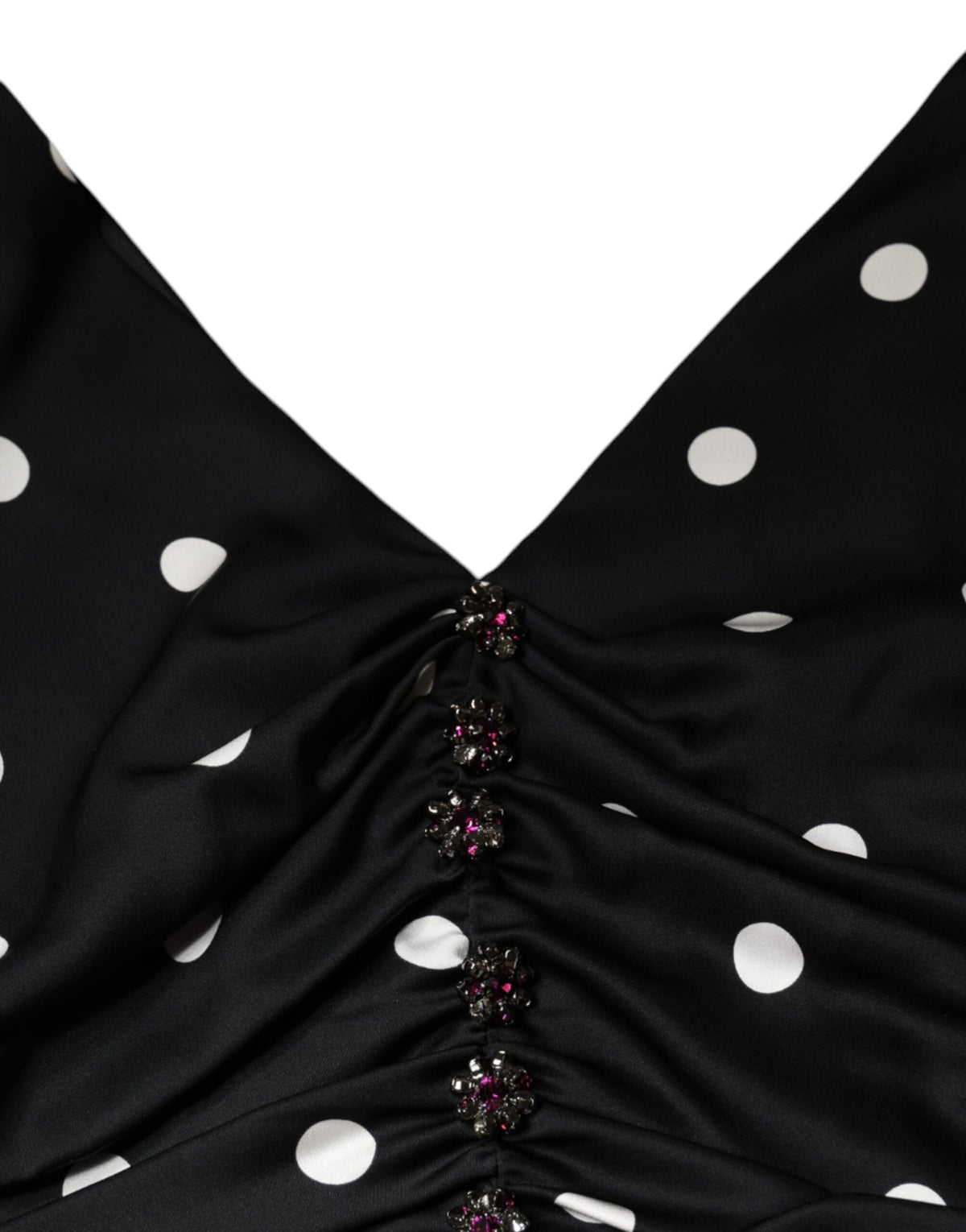 Elevate your wardrobe with the Dolce & Gabbana Black Silk Polka Dot V-neck Tassel Midi Dress, a masterpiece of Italian craftsmanship that embodies timeless elegance and allure.