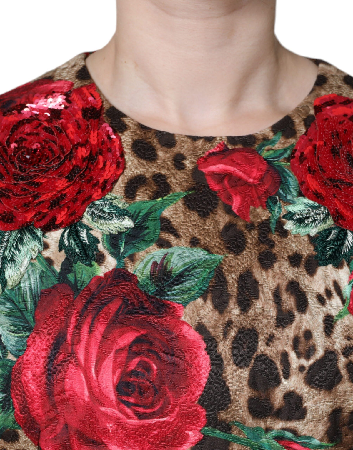 Indulge in the exquisite Dolce & Gabbana Brown Leopard Red Roses A-line Dress, a masterpiece of Italian craftsmanship that embodies luxury and sophistication for the discerning individual.