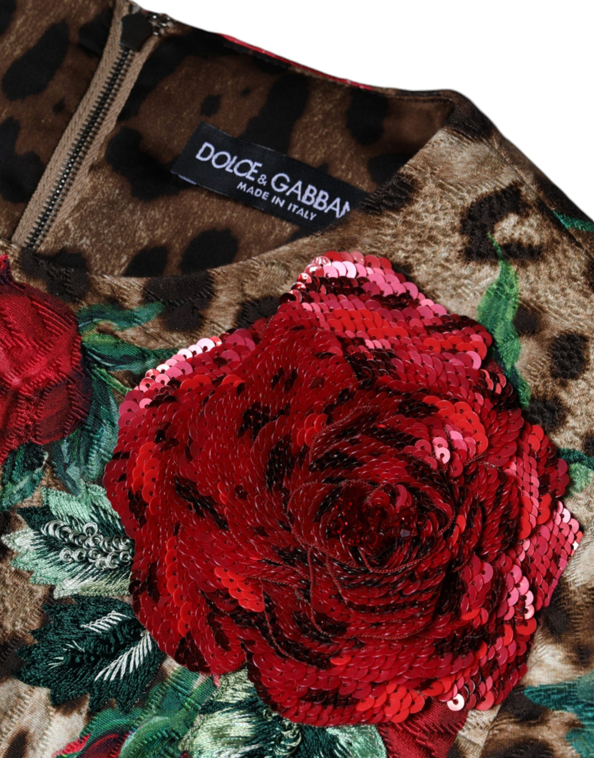 Indulge in the exquisite Dolce & Gabbana Brown Leopard Red Roses A-line Dress, a masterpiece of Italian craftsmanship that embodies luxury and timeless elegance for any discerning wardrobe.