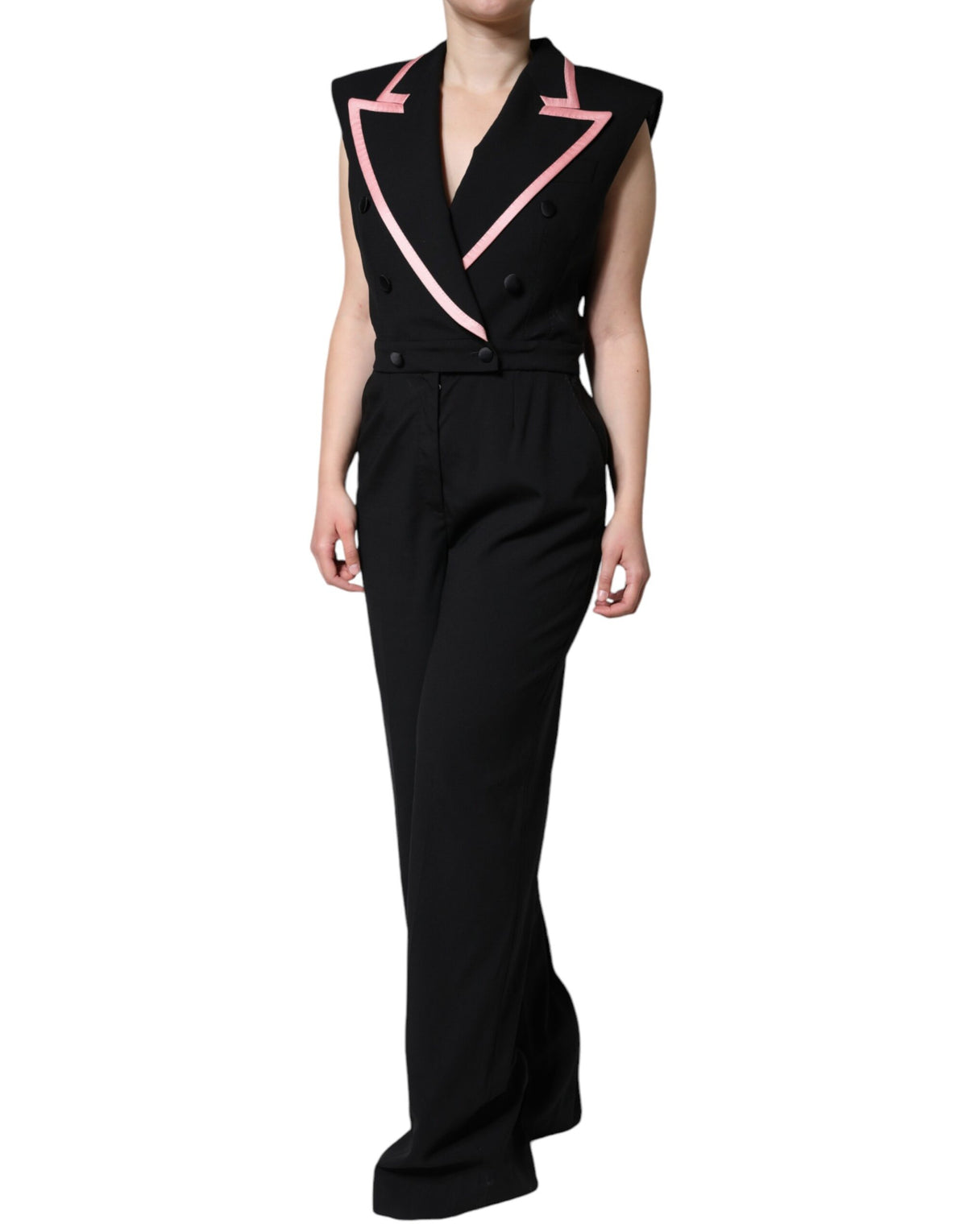 Indulge in the exquisite Dolce & Gabbana Black Wool Blend Sleeveless Jumpsuit Dress, a luxurious blend of virgin wool and silk, embodying elegance and sophistication for the discerning individual.