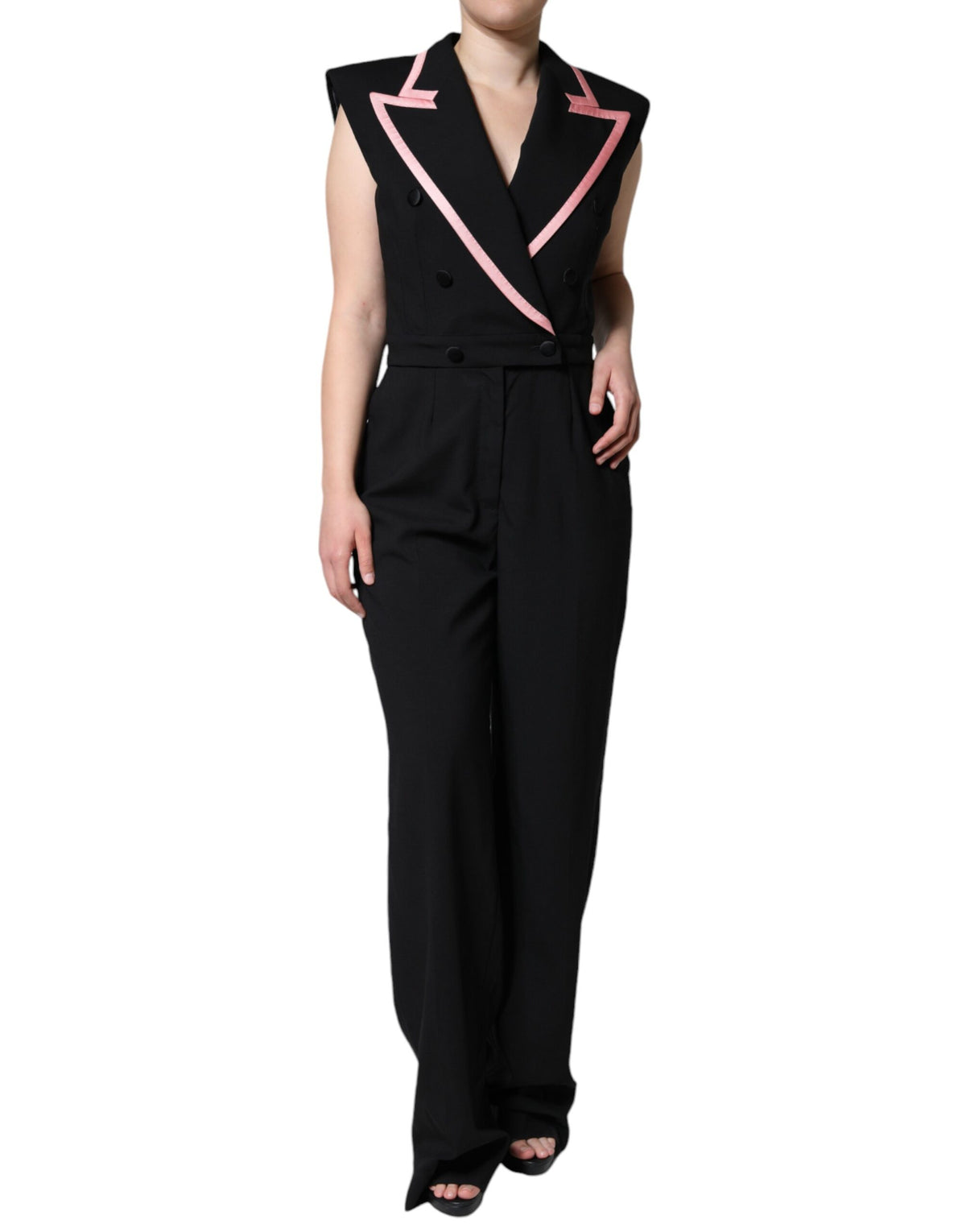 Indulge in the exquisite Dolce & Gabbana Black Wool Blend Sleeveless Jumpsuit Dress, a luxurious blend of virgin wool and silk, crafted for the discerning individual who embodies elegance and sophistication.
