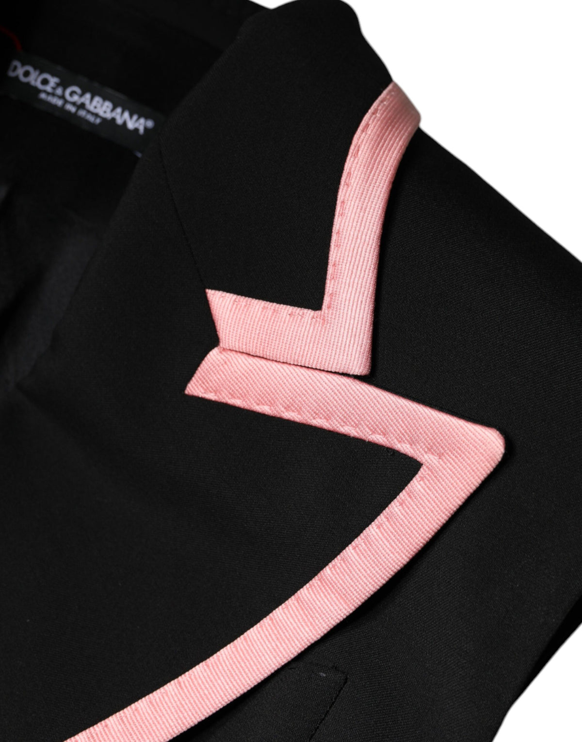 Indulge in the exquisite Dolce & Gabbana Black Wool Blend Sleeveless Jumpsuit Dress, a luxurious embodiment of Italian craftsmanship and timeless elegance for the discerning individual.