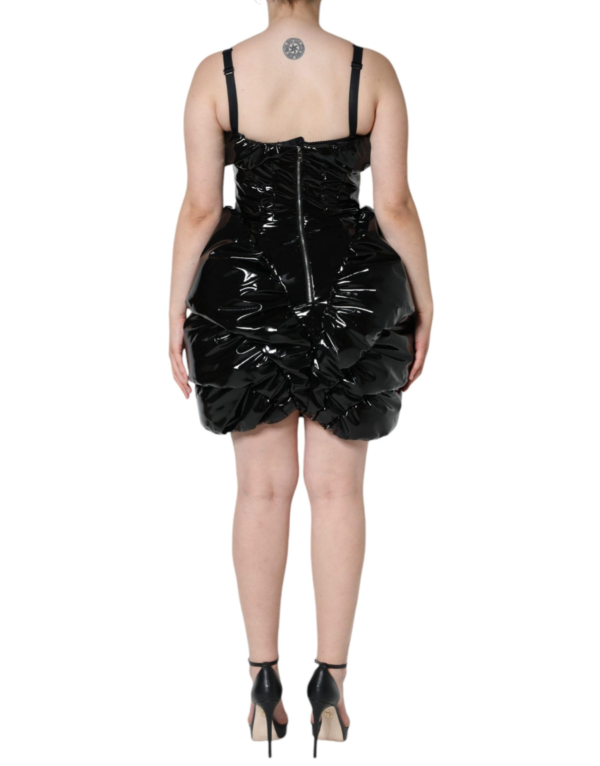Indulge in the exquisite allure of the Dolce & Gabbana Black Polyester Ruched Coated Mini Dress, crafted in Italy with luxurious materials for the discerning individual.