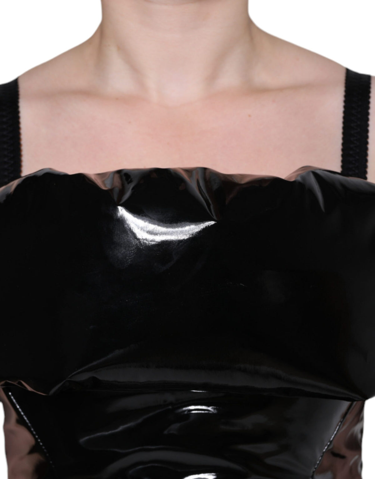 Indulge in the exquisite allure of the Dolce & Gabbana Black Polyester Ruched Coated Mini Dress, a masterpiece of Italian craftsmanship designed for the confident individual.