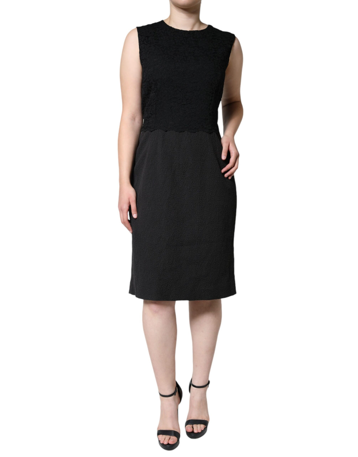 Indulge in the exquisite Dolce & Gabbana Black Cotton Sheath Knee Length Dress, crafted in Italy from luxurious materials, embodying timeless elegance and sophistication for the discerning individual.