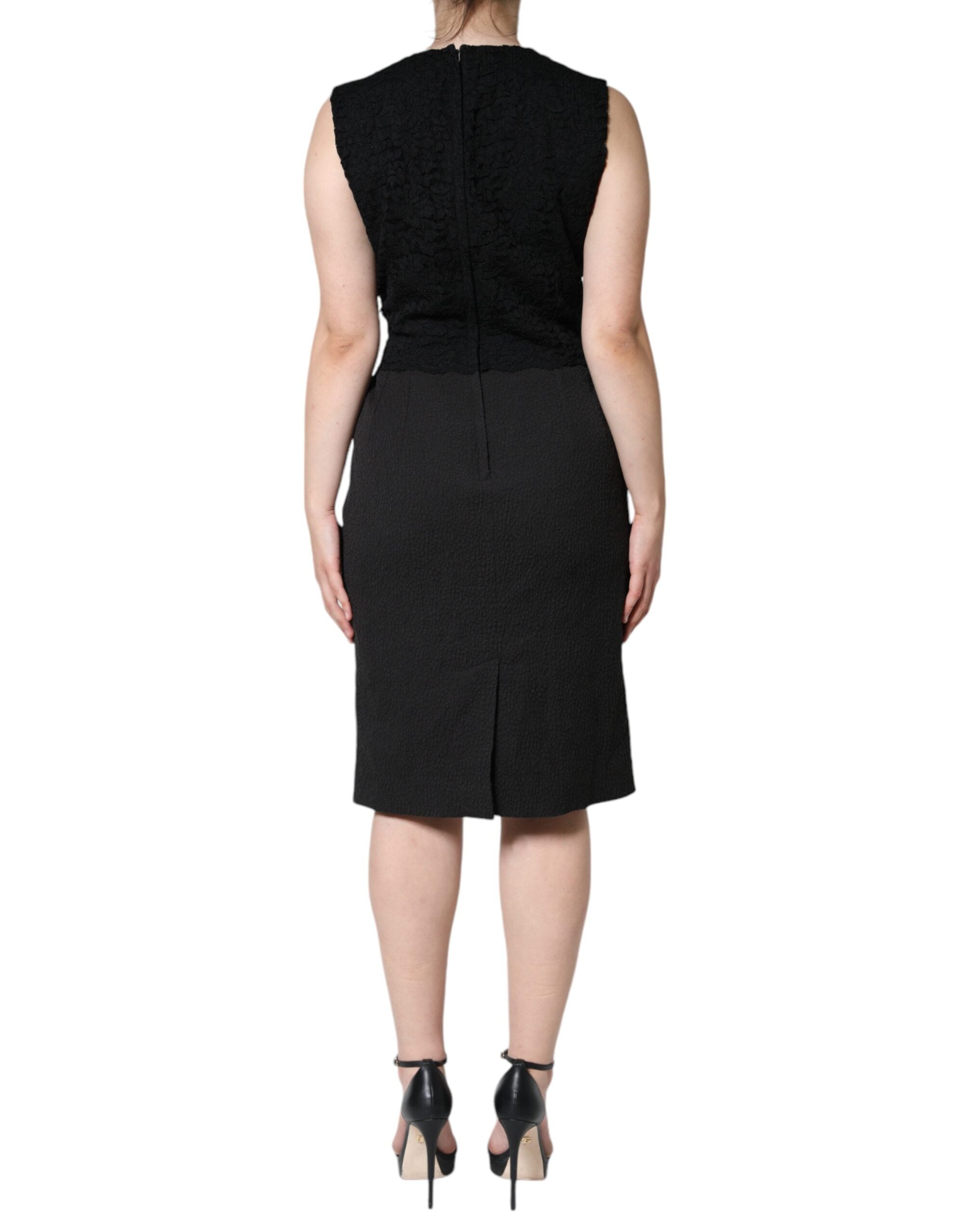 Experience the allure of the Dolce & Gabbana Black Cotton Sheath Dress, a masterpiece of Italian craftsmanship that embodies timeless elegance and luxurious comfort.