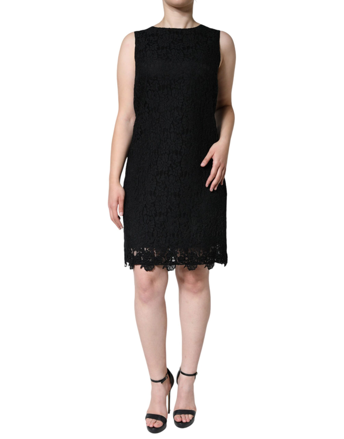 Indulge in the exquisite allure of the Dolce & Gabbana Black Floral Lace Sheath Mini Dress, a timeless masterpiece crafted in Italy, designed to elevate your elegance and sophistication.