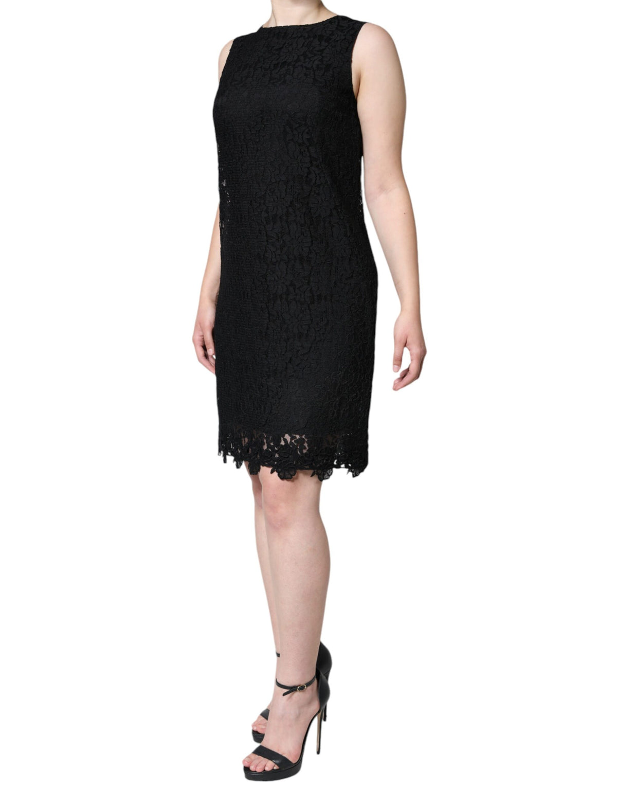 Indulge in the exquisite Dolce & Gabbana Black Floral Lace Sheath Mini Dress, a testament to Italian craftsmanship that elevates your elegance for any occasion.