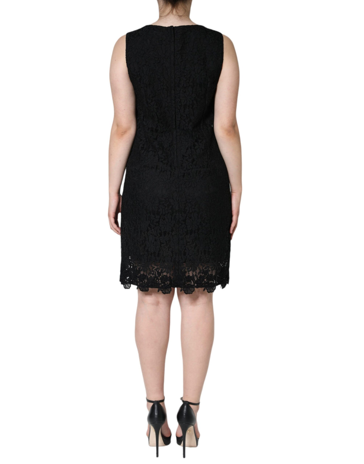 Indulge in the exquisite allure of the Dolce & Gabbana Black Floral Lace Sheath Mini Dress, a timeless masterpiece crafted from luxurious materials that elevate your elegance.