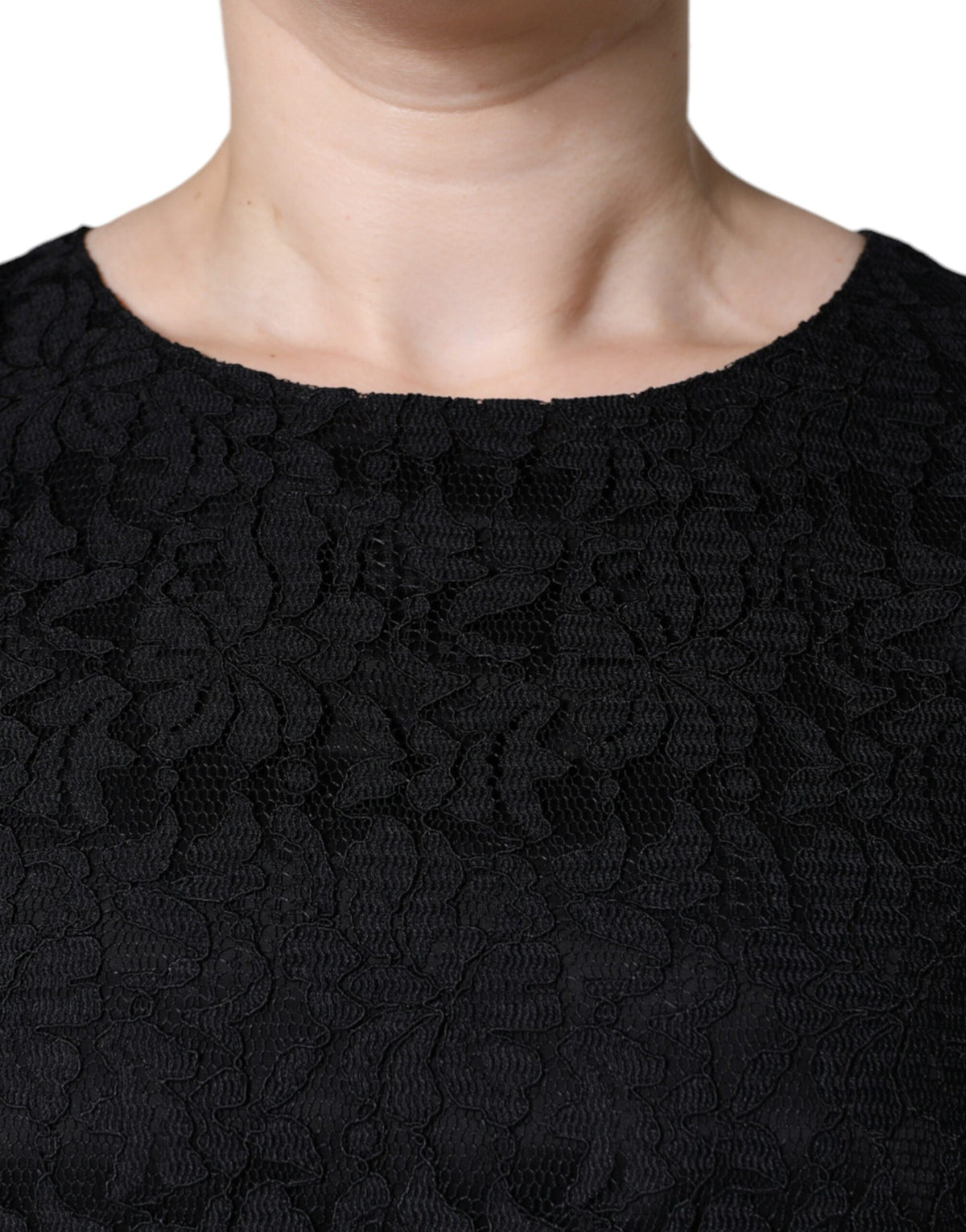 Indulge in the exquisite allure of the Dolce & Gabbana Black Floral Lace Sheath Mini Dress, a timeless masterpiece crafted in Italy, embodying elegance and sophistication for any occasion.