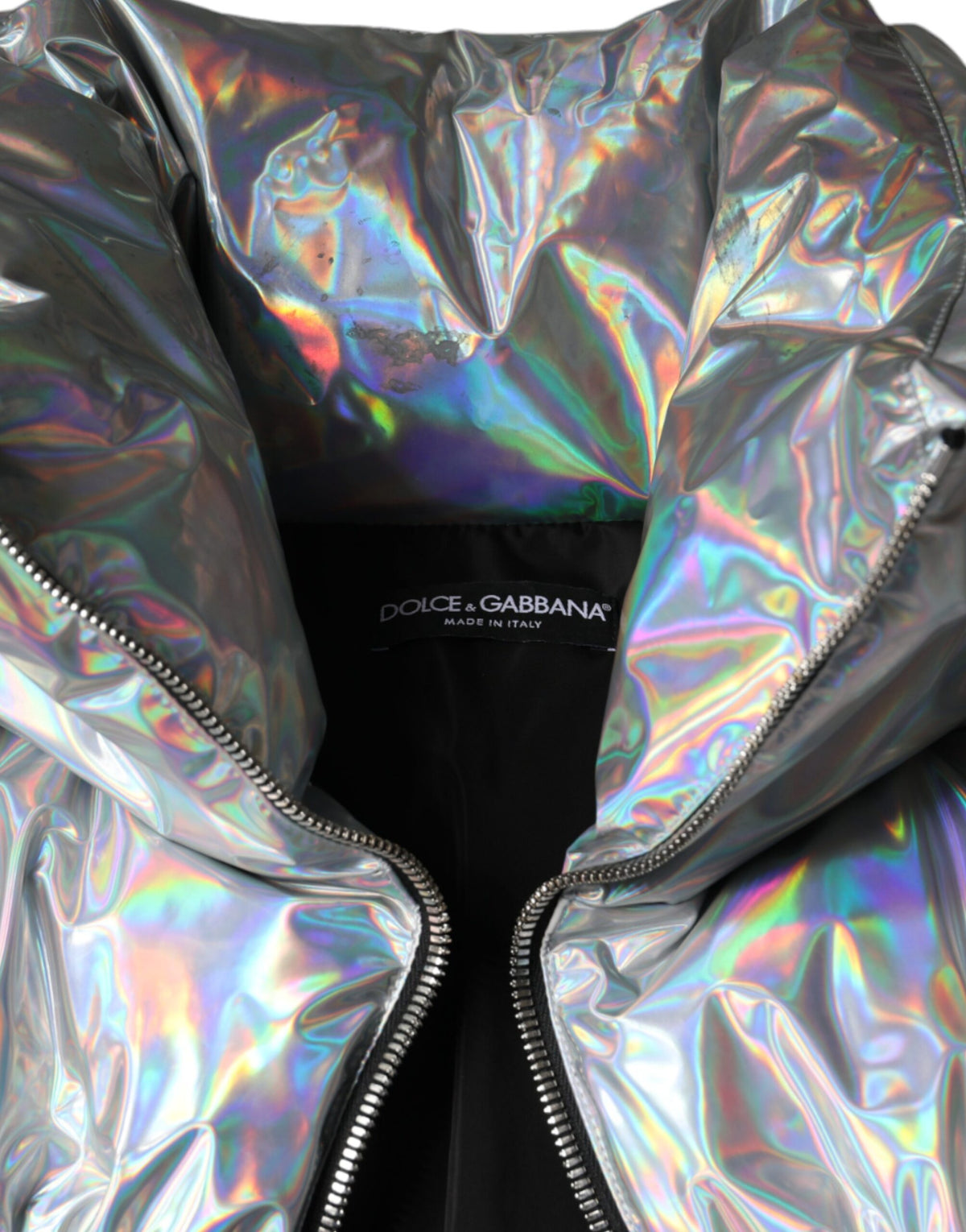 Elevate your style with the Dolce & Gabbana Silver Iridescent Puffer Full Zip Coat, a masterpiece of Italian craftsmanship in luxurious nylon, perfect for any sophisticated occasion.