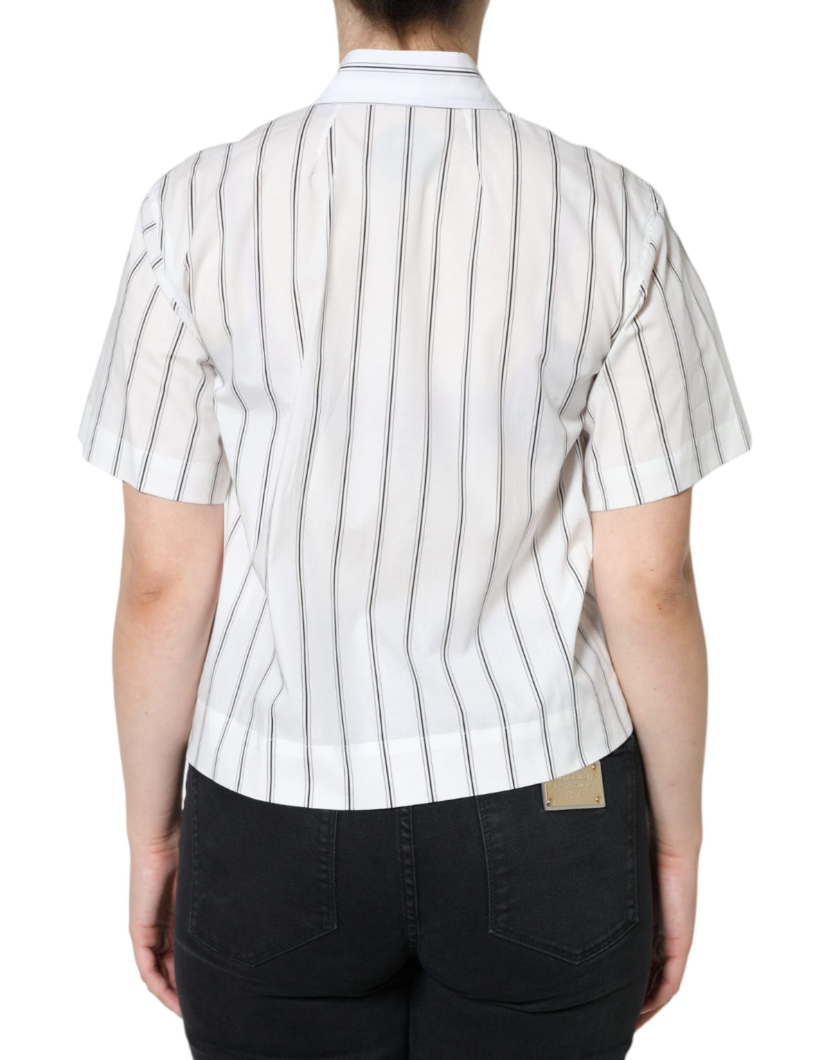 Discover the Dolce & Gabbana White Striped Collared Short Sleeve Polo Top, a fusion of Italian craftsmanship and luxurious cotton, perfect for the discerning individual.