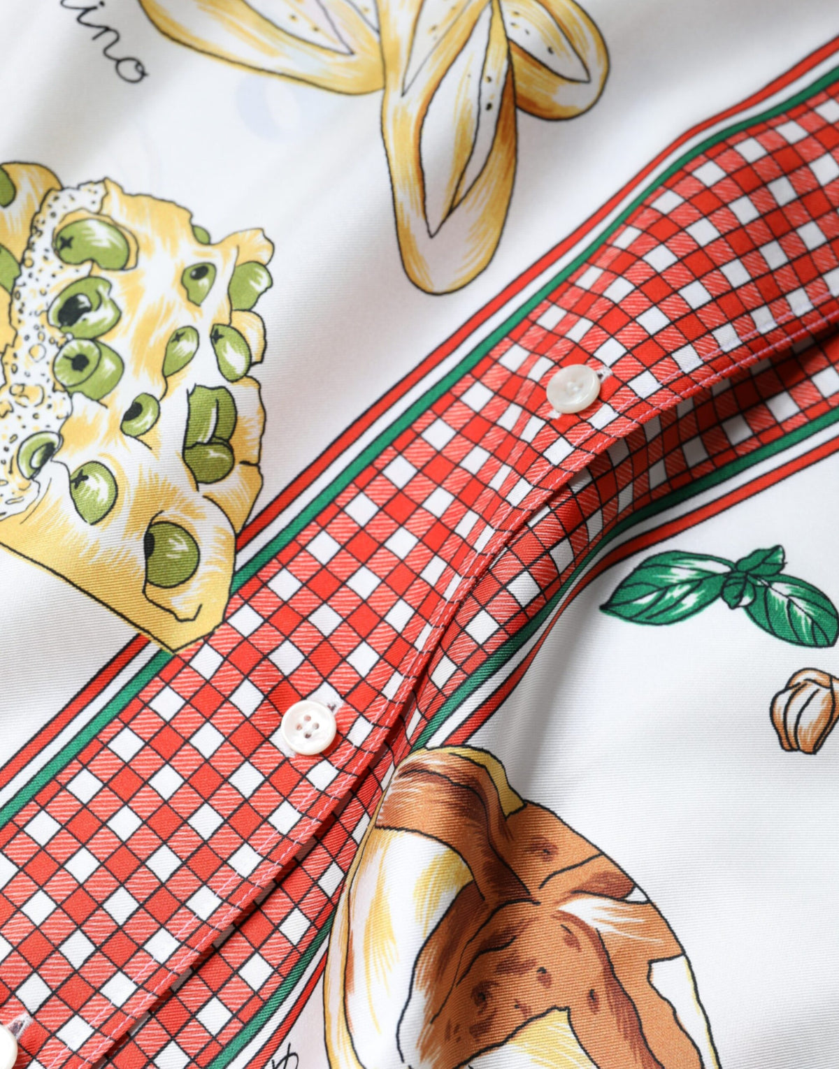 Indulge in the exquisite allure of the Dolce & Gabbana Multicolor Bread Print Collared Blouse, a silk masterpiece that embodies luxury and sophistication, perfect for any discerning wardrobe.