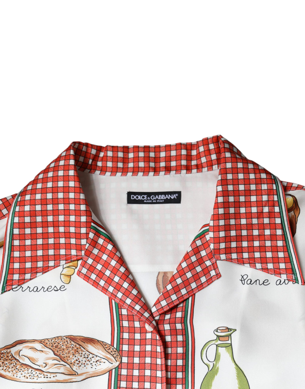 Indulge in the exquisite allure of the Dolce & Gabbana Multicolor Bread Print Collared Blouse, a silk masterpiece that embodies sophistication and artisanal elegance.