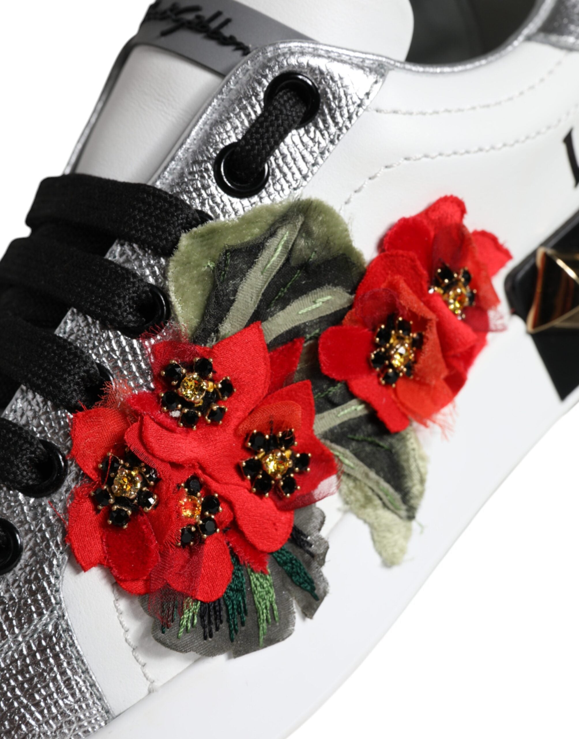 Indulge in the exquisite craftsmanship of Dolce & Gabbana's White Leather Floral Studded Sneakers, where luxury meets comfort, elevating your style with every step.
