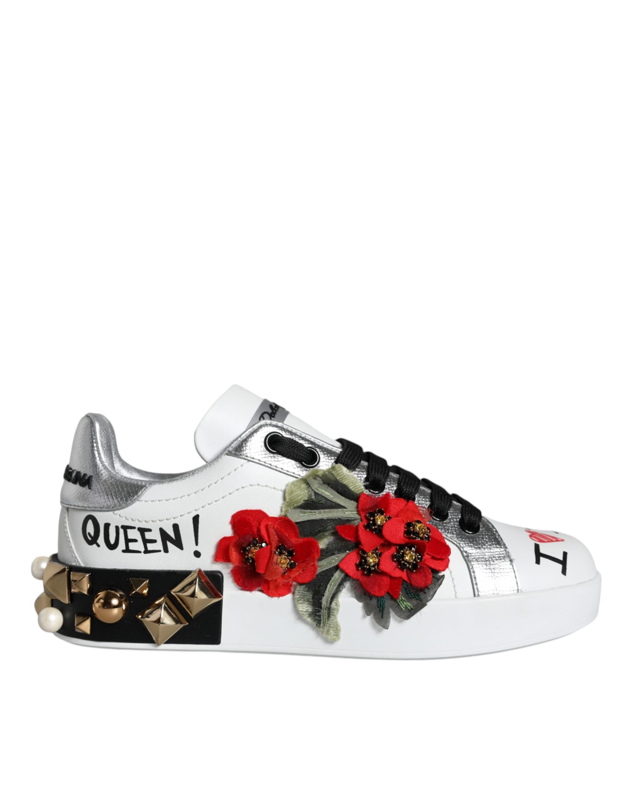 Indulge in the exquisite luxury of Dolce & Gabbana's White Leather Floral Studded Sneakers, where Italian craftsmanship meets timeless elegance for the discerning individual.