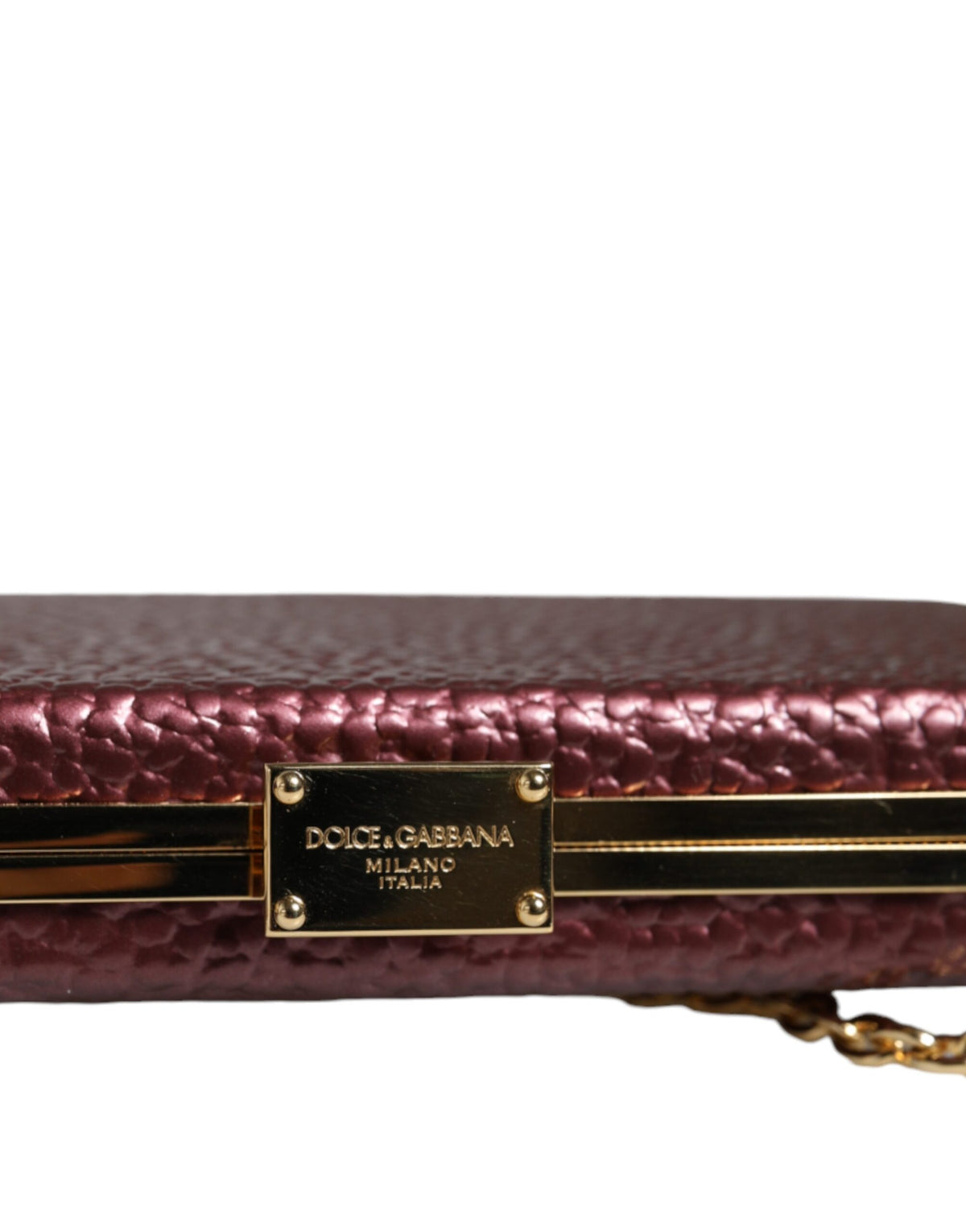 Elevate your elegance with the Dolce & Gabbana Maroon Leather Clutch, a masterpiece of Italian craftsmanship designed for the discerning individual.
