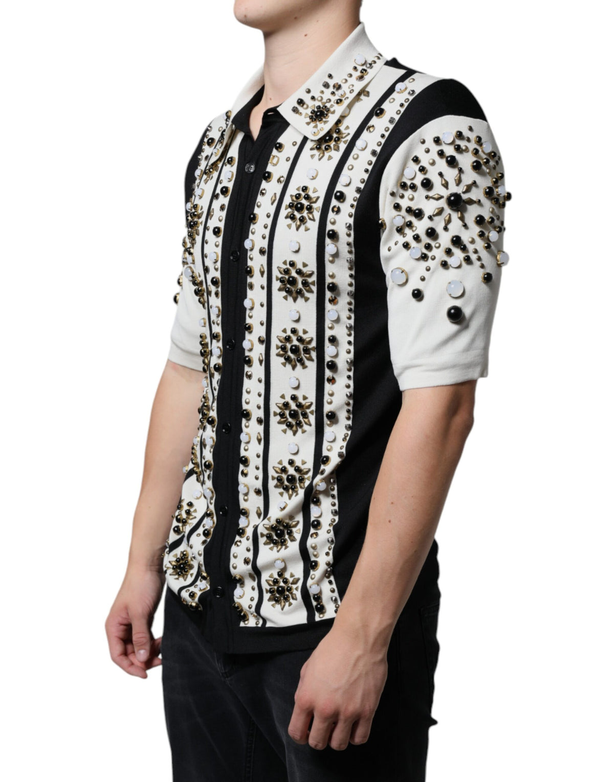 Indulge in the exquisite Dolce & Gabbana White Black Silk Studded Stone Crystal Shirt, where luxurious silk meets meticulous craftsmanship, embodying timeless elegance for the discerning individual.